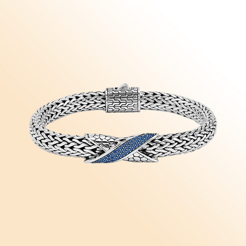 Sterling Silver woven bracelet featuring a vibrant Sapphire Quartz crisscross motif combined with a mirror-polished finish, offering expressive shine, refined craftsmanship, and balanced artistic detailing.