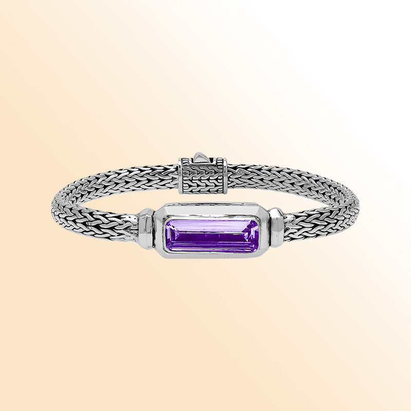 Sterling silver bracelet featuring an amethyst quartz baguette with a handwoven Balinese chain and oxidized finish.