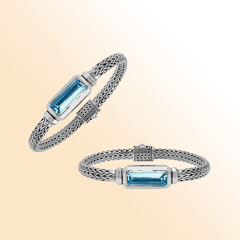 Sterling Silver woven bracelet showcasing a brilliant rectangular Blue Topaz Quartz motif with a polished finish, offering expressive shine, refined craftsmanship, and balanced artistic design.