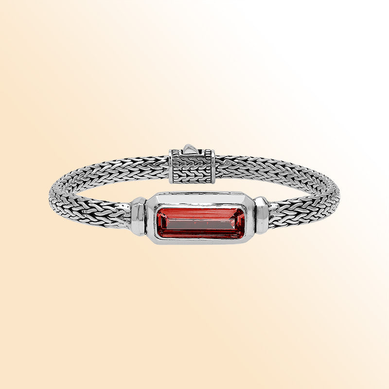 Handcrafted sterling silver bracelet featuring rectangular garnet quartz centerpiece on wheat chain design from Bali.
