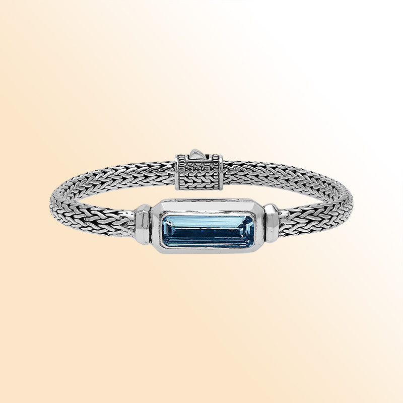 Sterling Silver woven bracelet showcasing a deep London Blue Topaz Quartz rectangular motif, polished to a bright mirror finish for an expressive accessory featuring detailed craftsmanship and color depth.