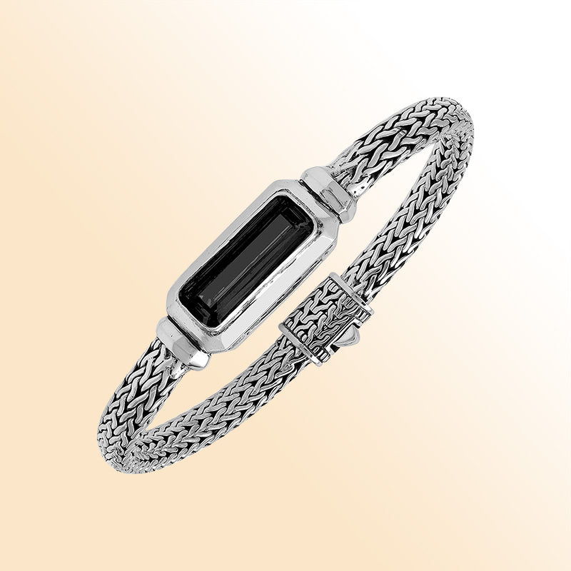 Sterling Silver woven bracelet showcasing a deep Black Onyx rectangular motif, finished with a bright mirror polish to provide expressive contrast and refined handcrafted detail.