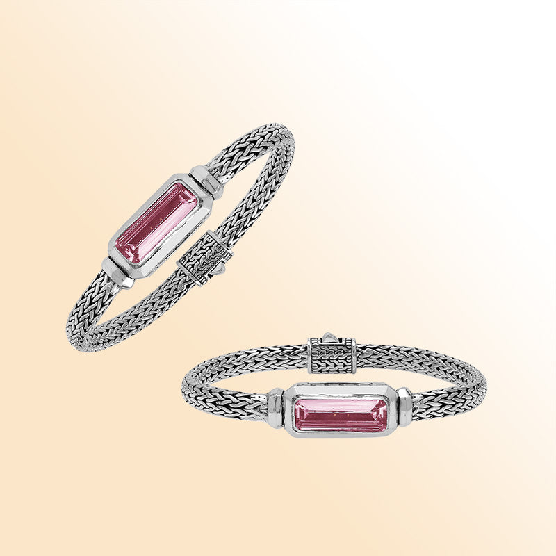 Sterling silver bracelet with handwoven Balinese chain and rectangular pink quartz baguette centerpiece.
