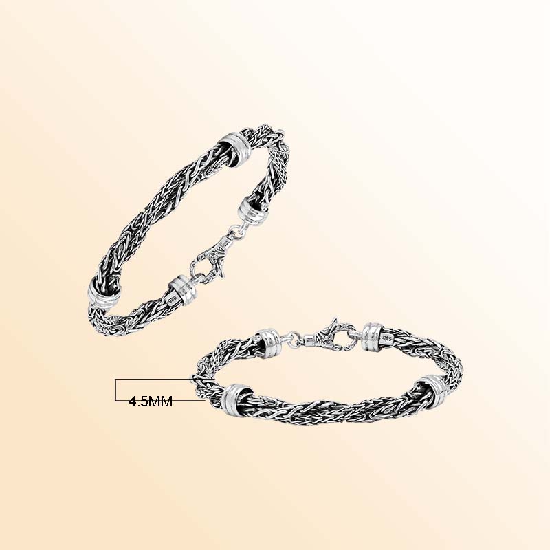 Sterling Silver bracelet with a twisted woven pattern, polished connectors, and an ornate lobster clasp, offering expressive texture, handcrafted detail, and a high-gloss finish.