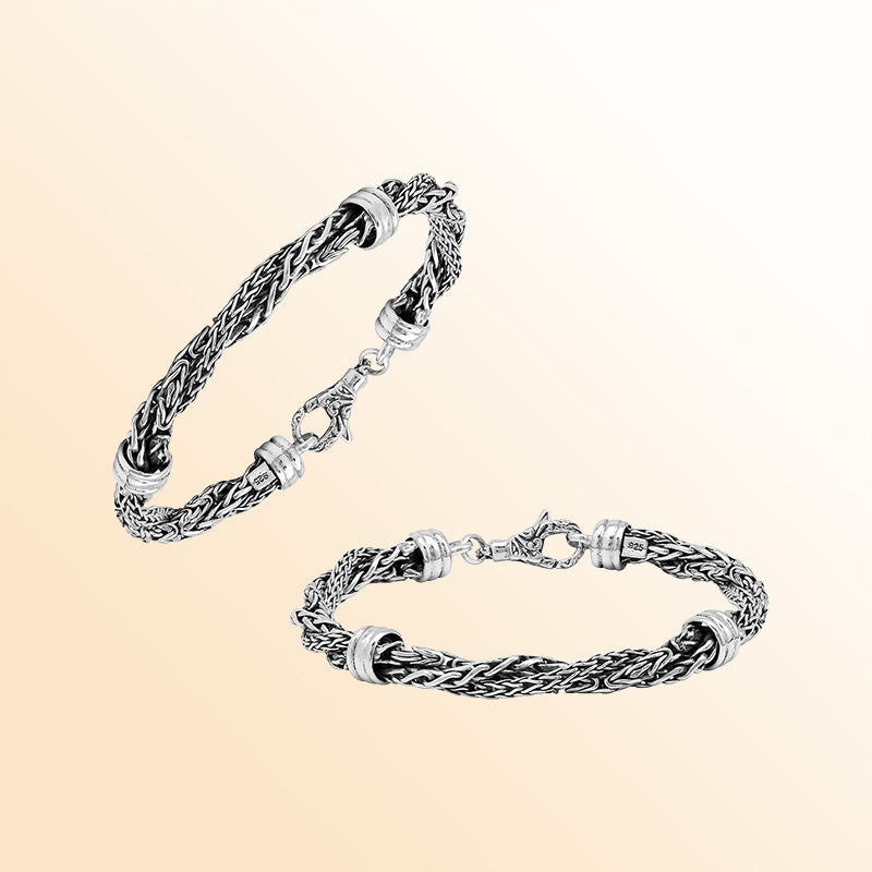 Sterling Silver bracelet with a twisted woven pattern, polished connectors, and an ornate lobster clasp, offering expressive texture, handcrafted detail, and a high-gloss finish.