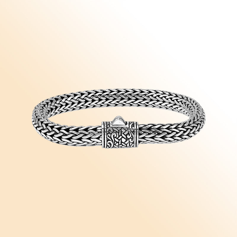 Sterling Silver thick woven bracelet featuring an intricate push lock and polished mirror finish, offering expressive handcrafted texture and elegant finishing details.