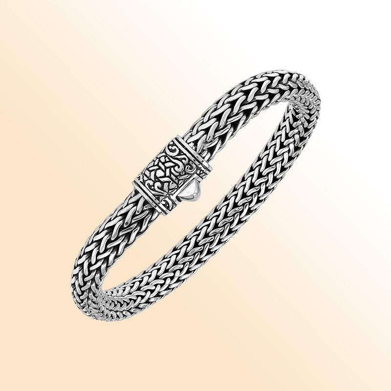Sterling Silver thick woven bracelet featuring an intricate push lock and polished mirror finish, offering expressive handcrafted texture and elegant finishing details.