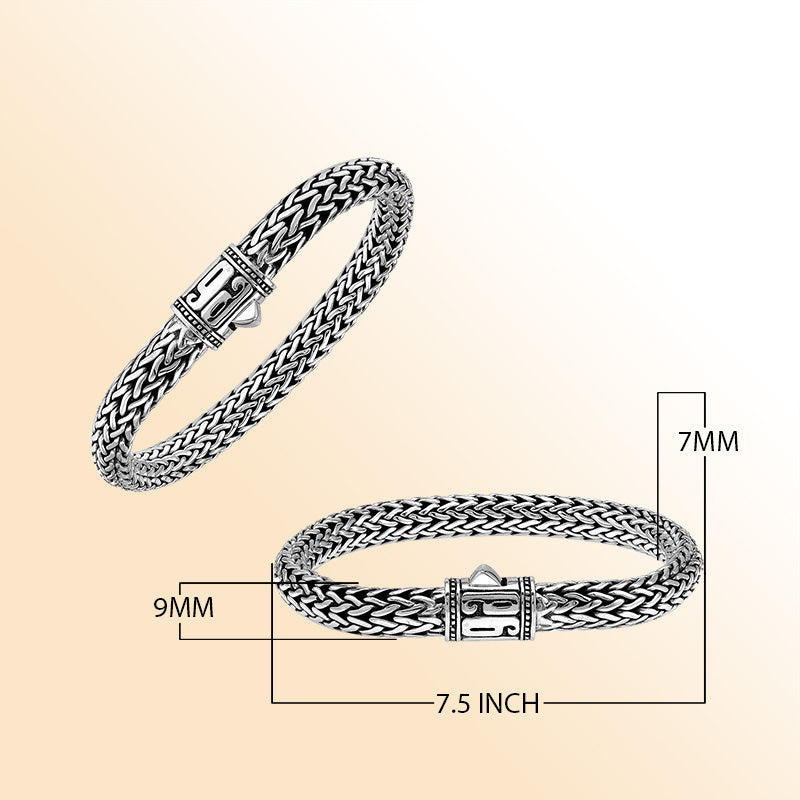 Sterling Silver thick woven bracelet with a sculpted push lock and a mirror-polished finish, offering expressive handcrafted character and refined detailing.