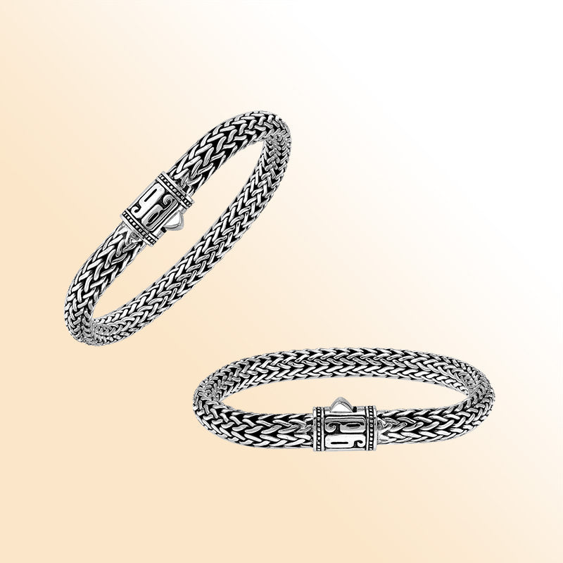 Sterling Silver thick woven bracelet with a sculpted push lock and a mirror-polished finish, offering expressive handcrafted character and refined detailing.