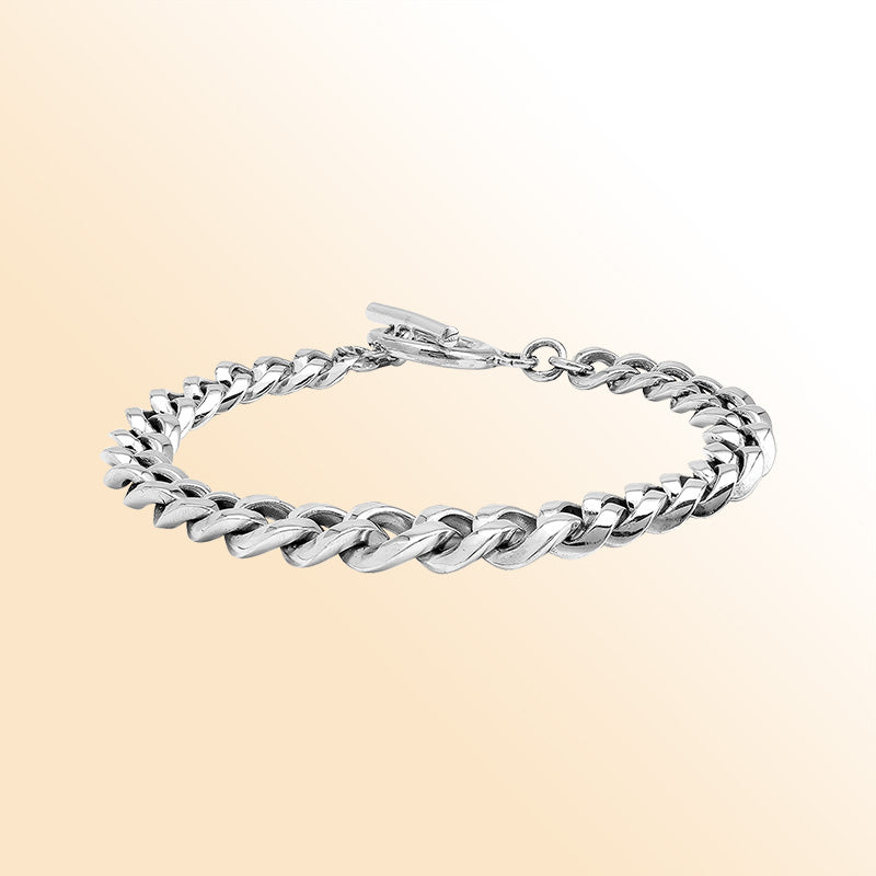 Sterling Silver bold curb chain bracelet with a polished toggle closure and high-gloss finish, offering expressive shine and refined handcrafted detail.