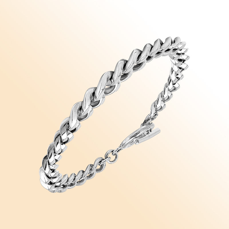 Sterling Silver bold curb chain bracelet with a polished toggle closure and high-gloss finish, offering expressive shine and refined handcrafted detail.