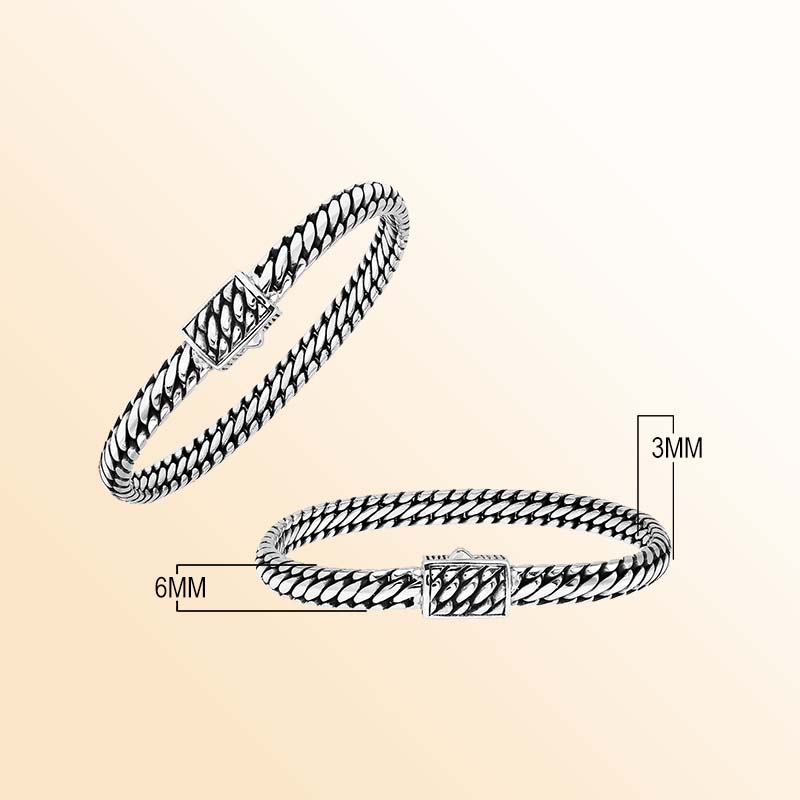 Sterling silver Eternal Weave artisan bracelet featuring dense braided links, oxidized depth, and a textured rectangular clasp