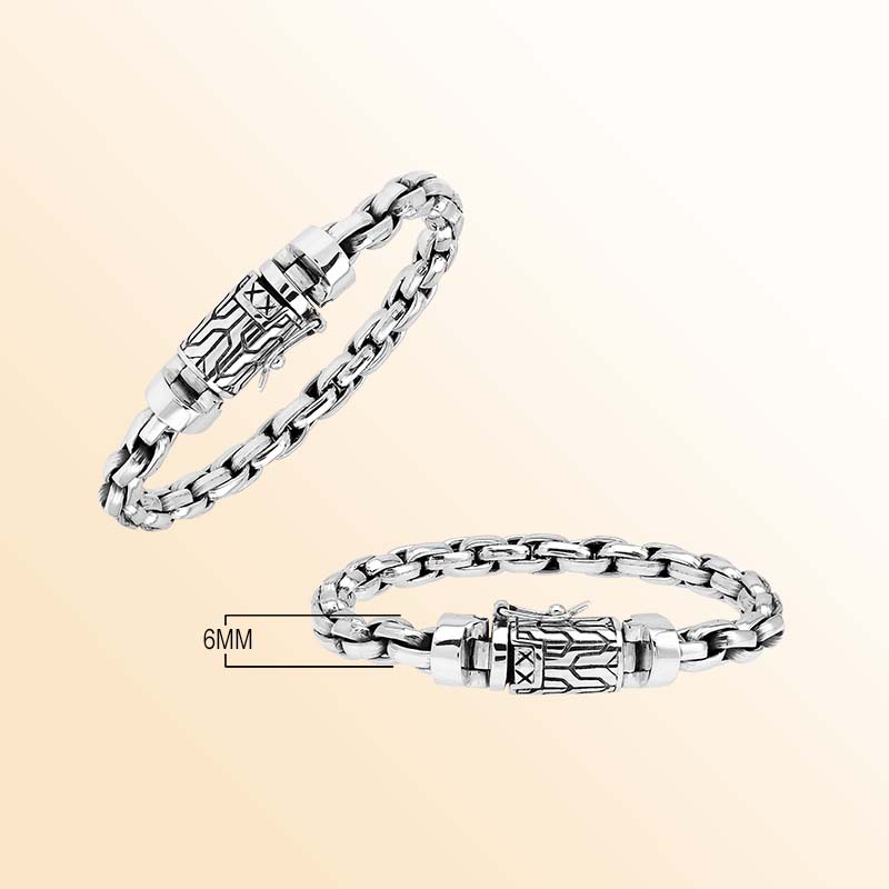 Artisan sterling silver bracelet showcasing bold braided round links, luminous polished surfaces, subtle oxidized depth, and a distinctive engraved box clasp.