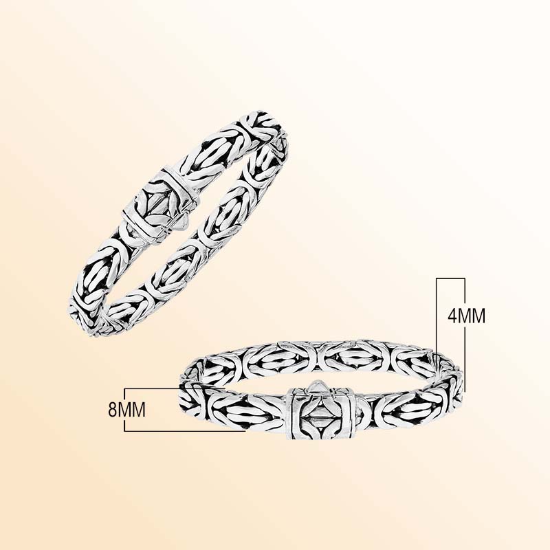 Sterling silver Eternal Weave bracelet featuring sculptural interlocking links, geometric push clasp, polished highlights, and rich oxidized accents
