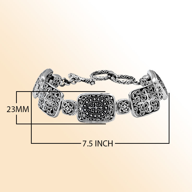 Sterling Silver bracelet featuring artistic rectangular scroll panels, sculpted detailing, decorative connectors, and a polished toggle lock inspired by Balinese craftsmanship.