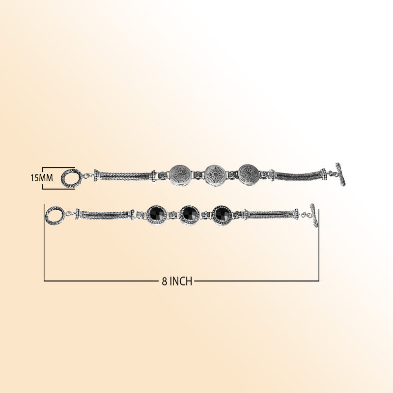 Elegant sterling silver bracelet featuring Black Onyx stones, ornate Balinese motifs, multi-strand chains, and a toggle clasp.