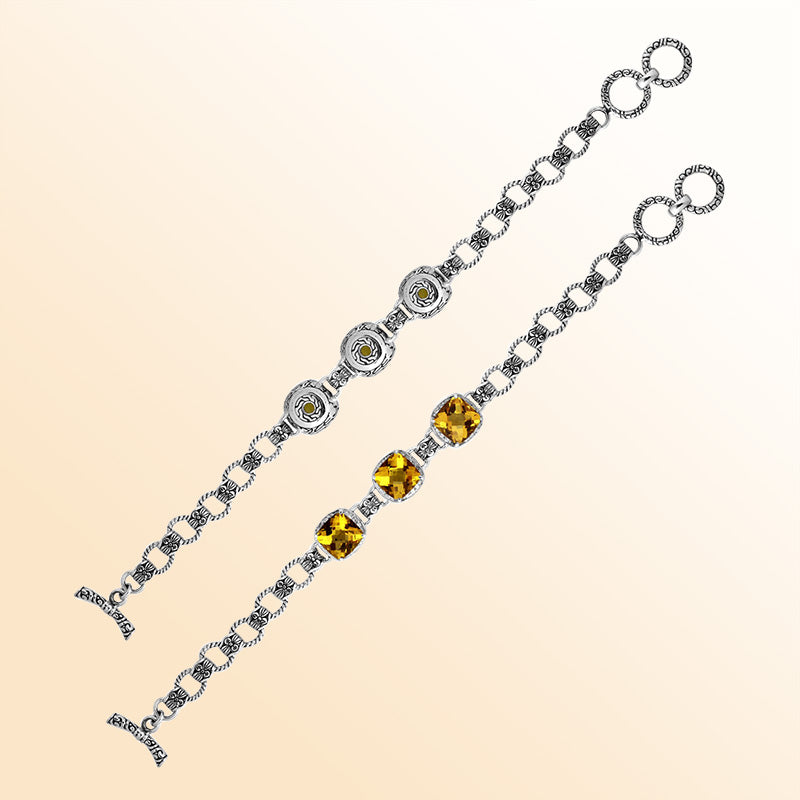 Retail sterling silver bracelet featuring luminous golden Citrine Quartz stones set in ornate Balinese-style frames with detailed chain accents and a refined toggle lock for daily elegance.