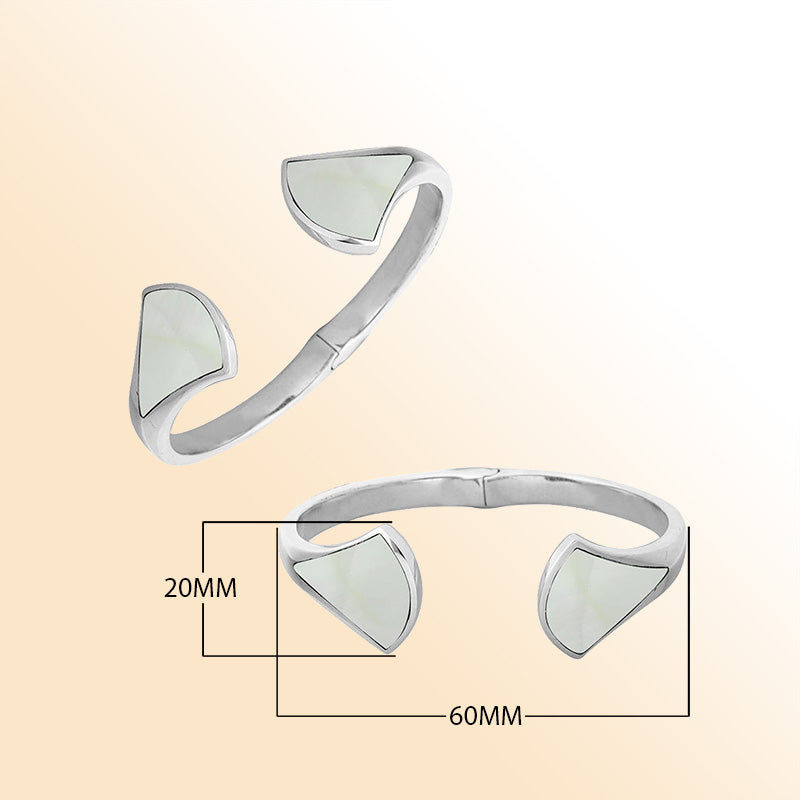 Retail sterling silver cuff with luminous Mother Of Pearl inlays set on sculpted open ends, featuring a polished finish and hinge lock for elegant daily wear.