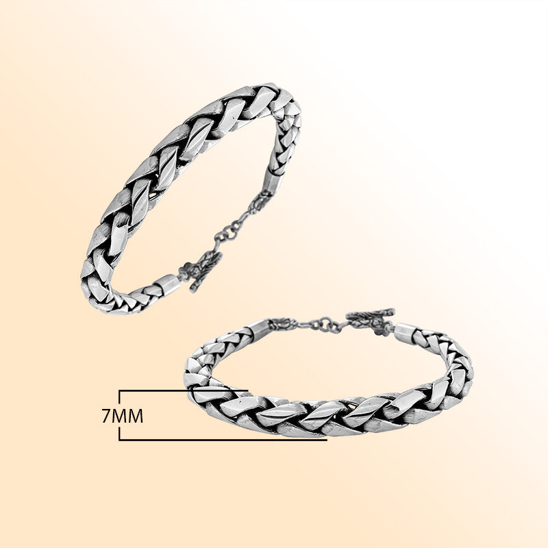 Retail sterling silver bracelet featuring a bold 7MM round braided chain with polished detailing, oxidized accents, and a toggle lock for luxurious everyday styling.