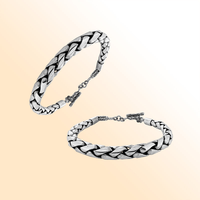 Retail sterling silver bracelet featuring a bold 7MM round braided chain with polished detailing, oxidized accents, and a toggle lock for luxurious everyday styling.