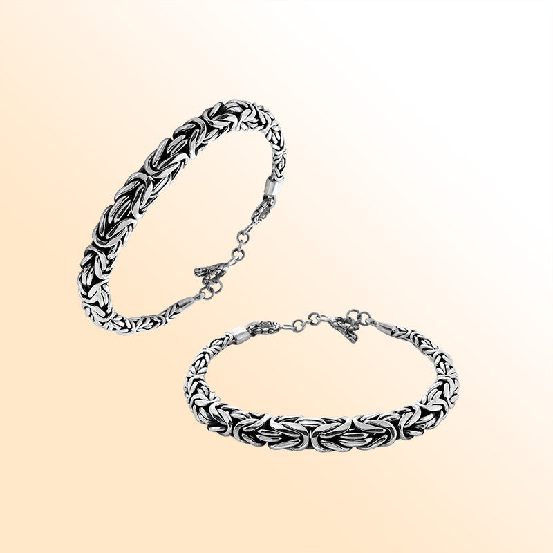Retail sterling silver bracelet featuring a bold 7MM x 9MM braided chain with polished highlights, oxidized details, and a secure toggle lock for elevated everyday styling.