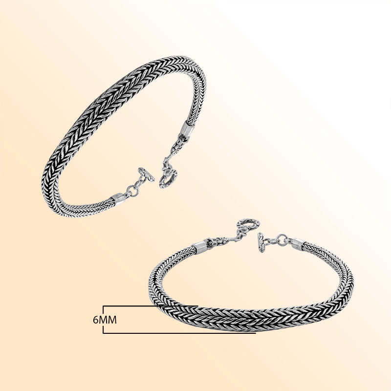 Retail sterling silver bracelet featuring a 6MM round woven Balinese chain with polished finishing, oxidized texture, and a toggle lock for elegant everyday wear.