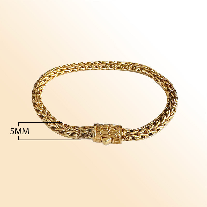 Retail 18K gold bracelet featuring a polished 5MM woven Balinese chain with elegant braided detailing and a secure push clasp for luxurious everyday wear.