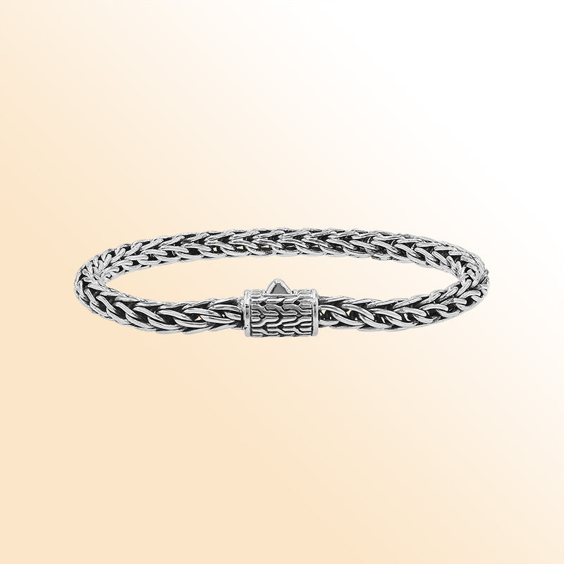 Retail sterling silver bracelet featuring a luxurious 5MM woven Balinese chain with polished detailing and a secure push clasp for elegant daily wear.