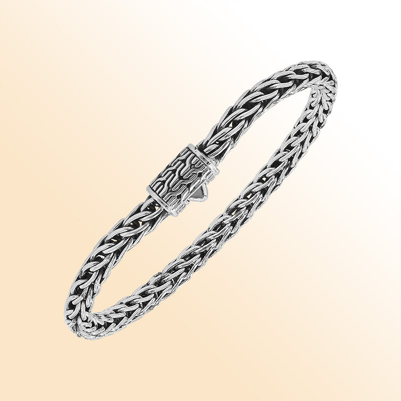 Retail sterling silver bracelet featuring a luxurious 5MM woven Balinese chain with polished detailing and a secure push clasp for elegant daily wear.