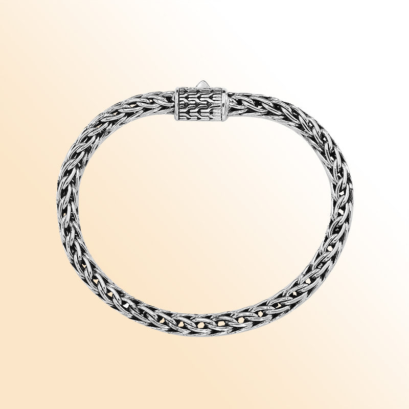 Retail sterling silver bracelet featuring a luxurious 5MM woven Balinese chain with polished detailing and a secure push clasp for elegant daily wear.