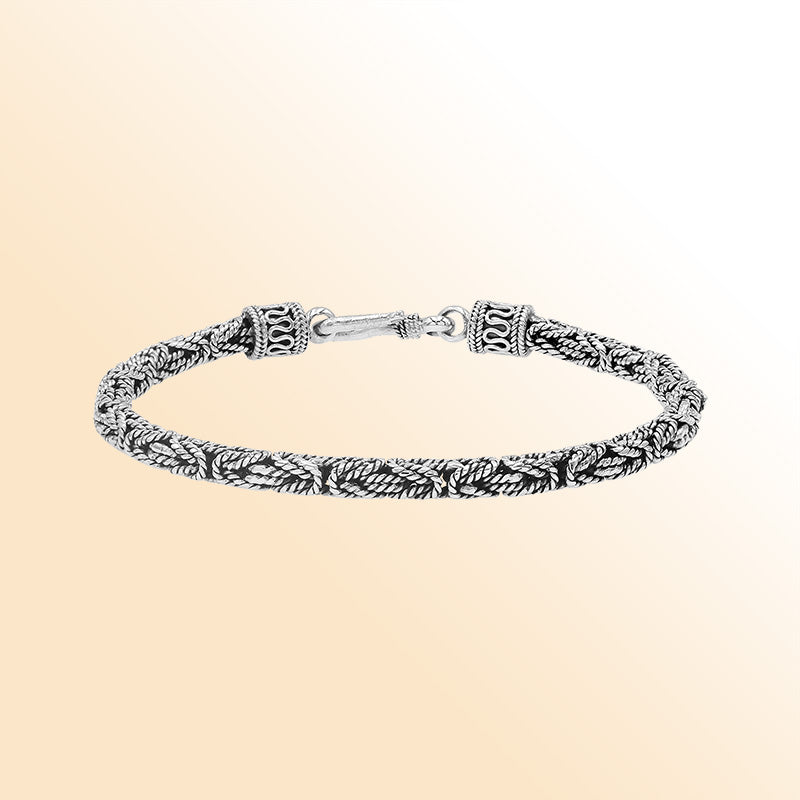 Handcrafted sterling silver Balinese bracelet with oxidized finish and detailed hook clasp.