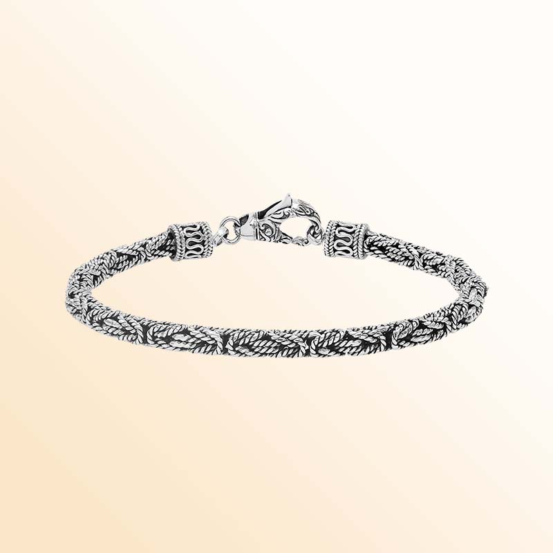 Handcrafted sterling silver Balinese bracelet with oxidized finish and detailed hook clasp.