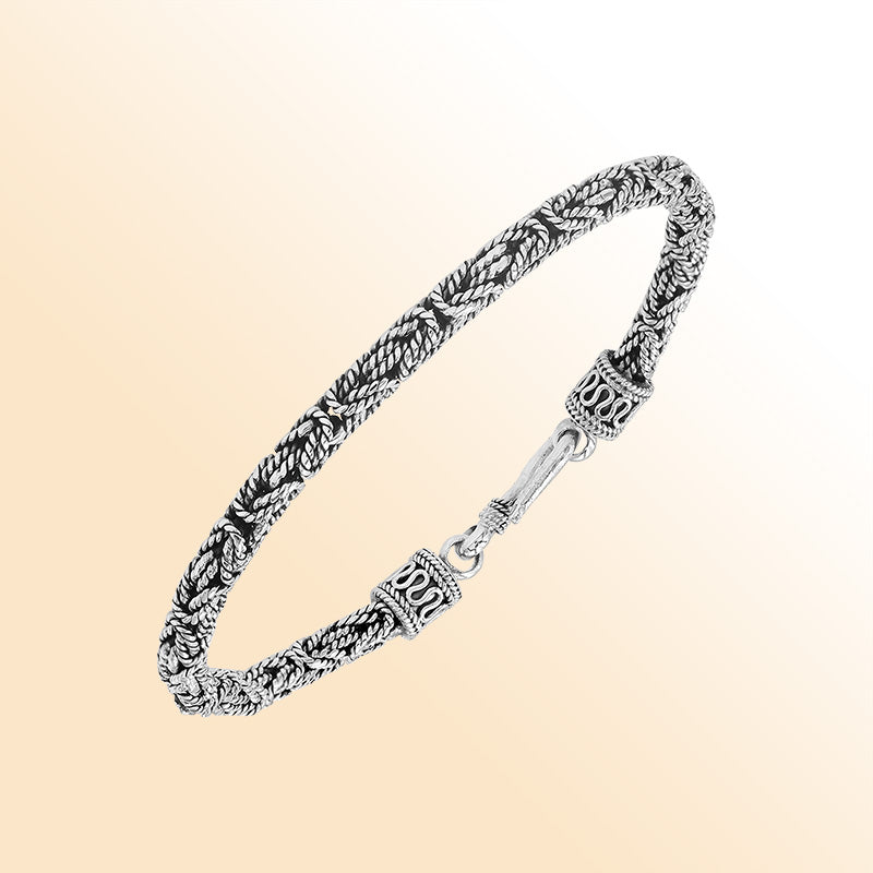 Handcrafted sterling silver Balinese bracelet with oxidized finish and detailed hook clasp.