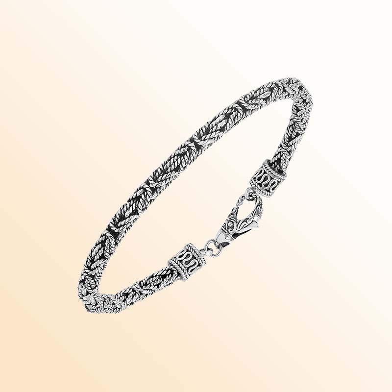 Handcrafted sterling silver Balinese bracelet with oxidized finish and detailed hook clasp.