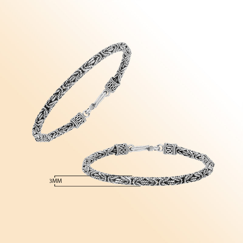 Handcrafted sterling silver Balinese bracelet with oxidized finish and detailed hook clasp.