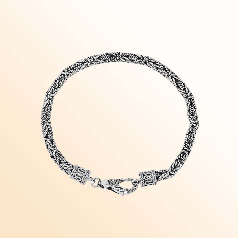Handcrafted sterling silver Balinese bracelet with oxidized finish and detailed hook clasp.