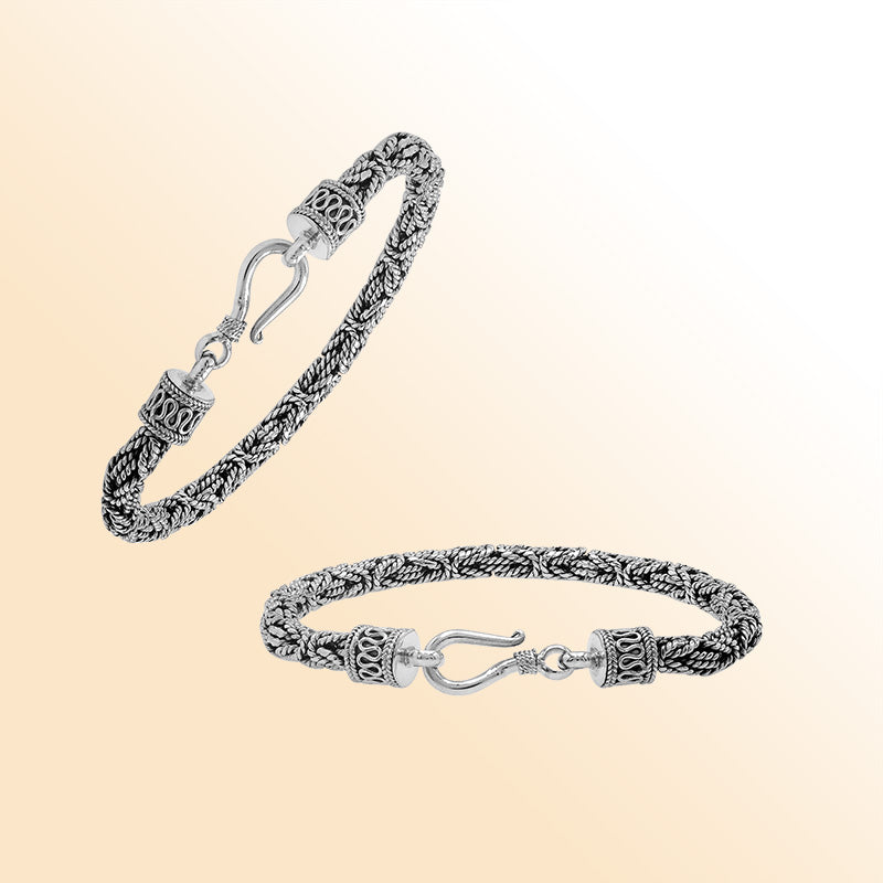 Retail sterling silver bracelet featuring a polished and oxidized 4MM woven Balinese chain with a secure lobster lock for refined daily wear.