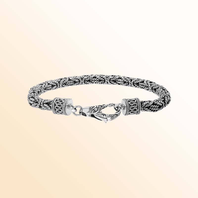 Retail sterling silver bracelet featuring a polished and oxidized 4MM woven Balinese chain with a secure lobster lock for refined daily wear.