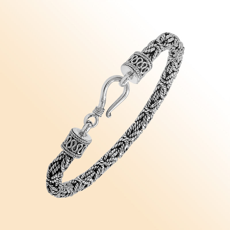 Retail sterling silver bracelet featuring a polished and oxidized 4MM woven Balinese chain with a secure lobster lock for refined daily wear.