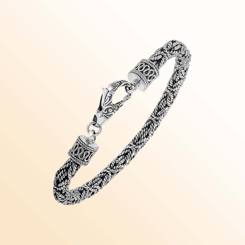 Retail sterling silver bracelet featuring a polished and oxidized 4MM woven Balinese chain with a secure lobster lock for refined daily wear.