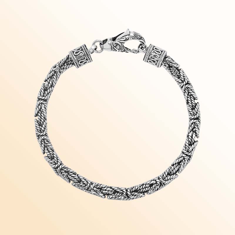 Retail sterling silver bracelet featuring a polished and oxidized 4MM woven Balinese chain with a secure lobster lock for refined daily wear.