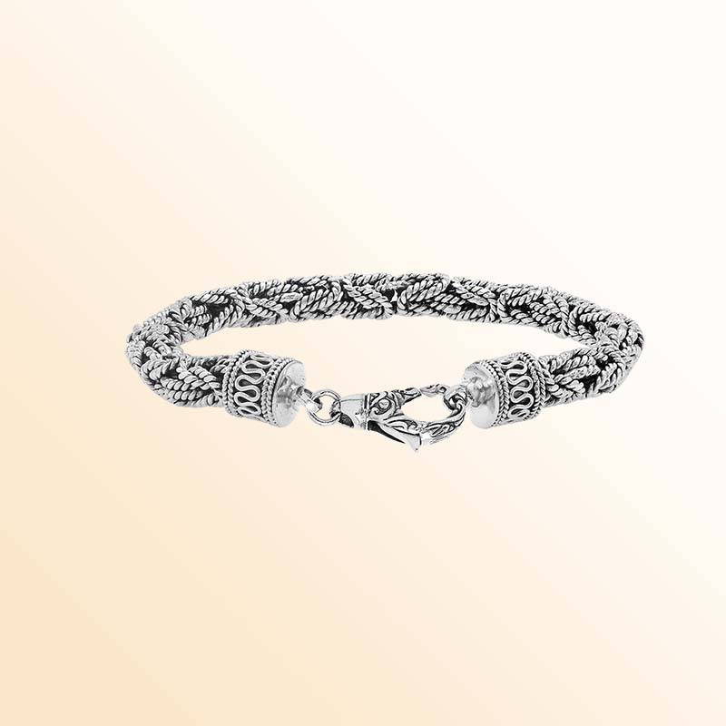Retail sterling silver bracelet showcasing an elegant 6MM woven Balinese chain design with oxidized accents and a strong lobster lock for everyday luxury wear.
