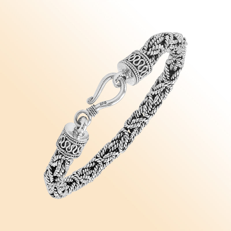 Retail sterling silver bracelet showcasing an elegant 6MM woven Balinese chain design with oxidized accents and a strong lobster lock for everyday luxury wear.