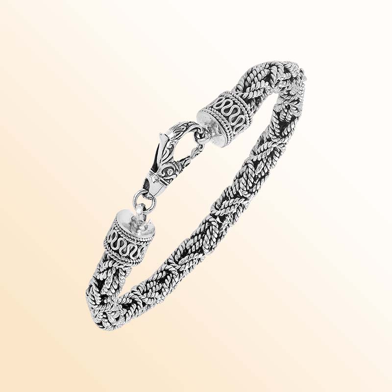 Retail sterling silver bracelet showcasing an elegant 6MM woven Balinese chain design with oxidized accents and a strong lobster lock for everyday luxury wear.
