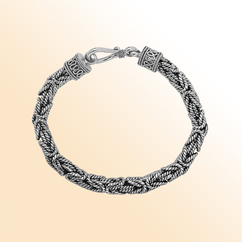 Retail sterling silver bracelet showcasing an elegant 6MM woven Balinese chain design with oxidized accents and a strong lobster lock for everyday luxury wear.