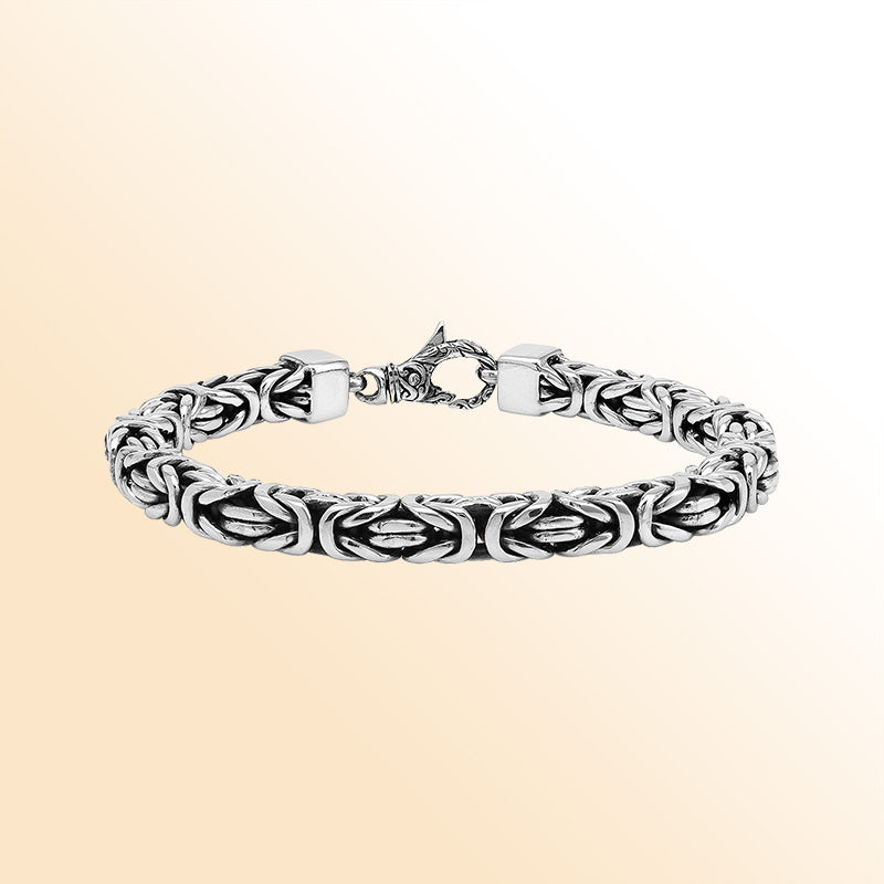 Retail sterling silver bracelet showcasing a detailed 7MM Balinese woven chain with polished and oxidized elements paired with a secure lobster lock.