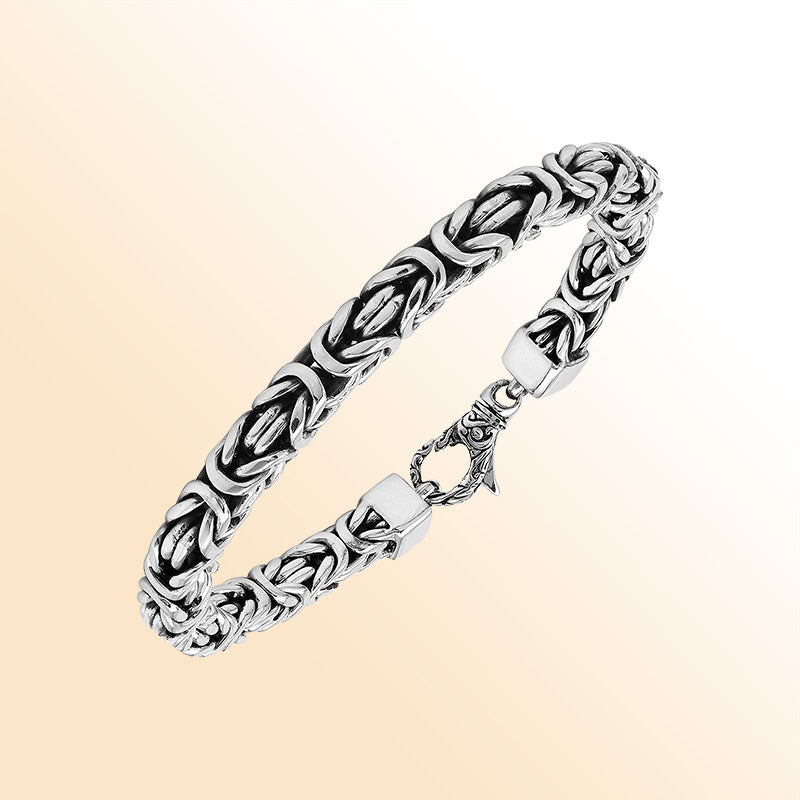 Retail sterling silver bracelet showcasing a detailed 7MM Balinese woven chain with polished and oxidized elements paired with a secure lobster lock.