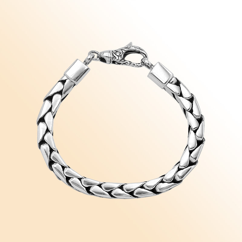 Retail sterling silver bracelet showcasing a polished 4MM flat-weave chain with oxidized details and a durable, secure lobster lock.