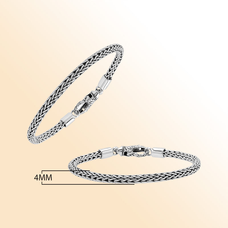 Retail sterling silver bracelet with a 4MM woven chain featuring polished and oxidized detailing and a decorative lobster lock designed for secure everyday wear.