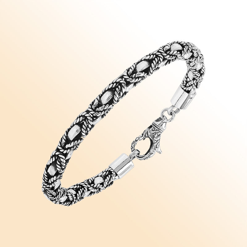 Retail sterling silver bracelet featuring a 5MM braided-pattern chain with oxidized detailing and a decorative lobster lock designed for fashionable and secure everyday wear.